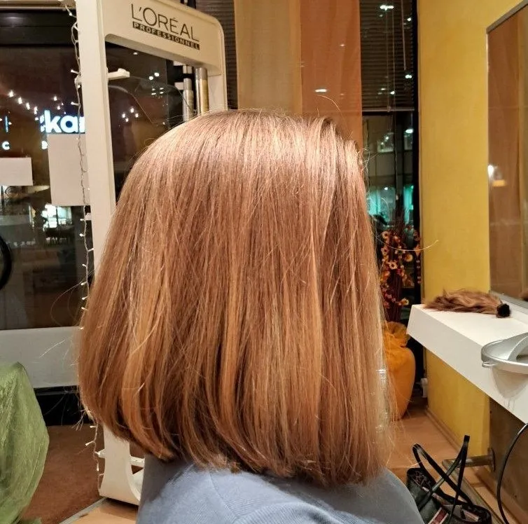 Nachher: Von lockiger Naturwelle zu kurzem, luftigem Pixie-Cut